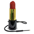 Lipstick-shaped device with gold casing and red top on a white background