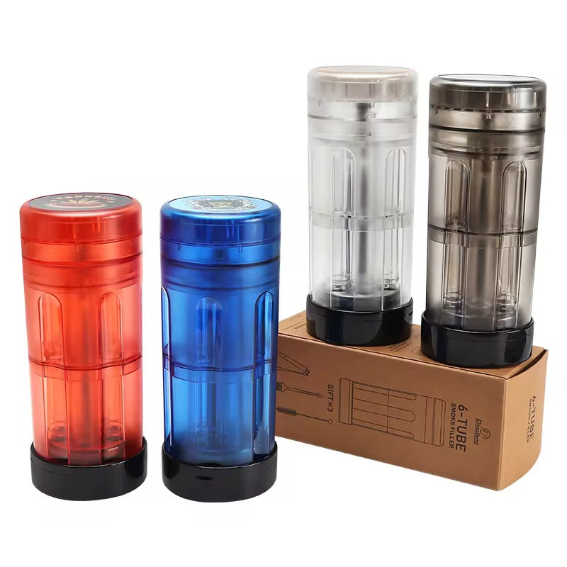 Set of four cylindrical containers in red, blue, and clear with black caps, alongside a cardboard box on a white background.
